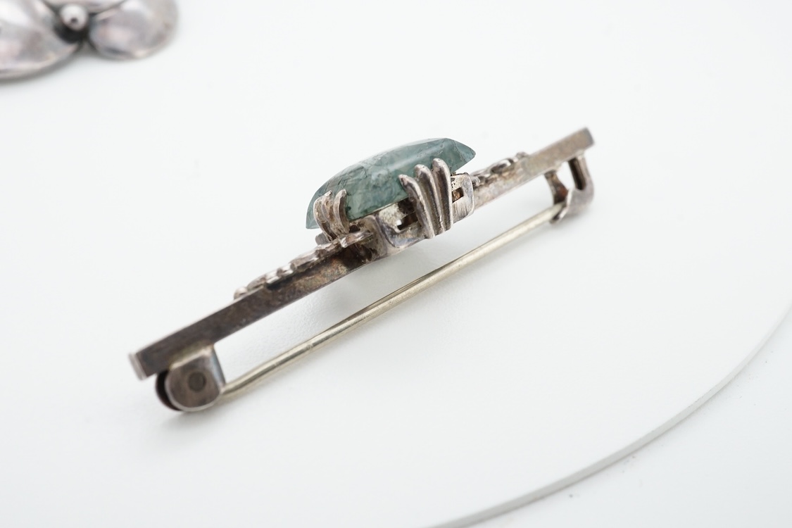 A 1960's Danish silver foliate brooch, by Nils Erik From, import marks possibly for Henry James Hulbert, London, 1964, 37mm, together with a moss agate set white metal bar brooch and a two colour enamel and paste set met